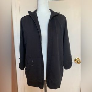 Alia black Jacket, open front zip, 3/4 sleeves with a snap to roll up